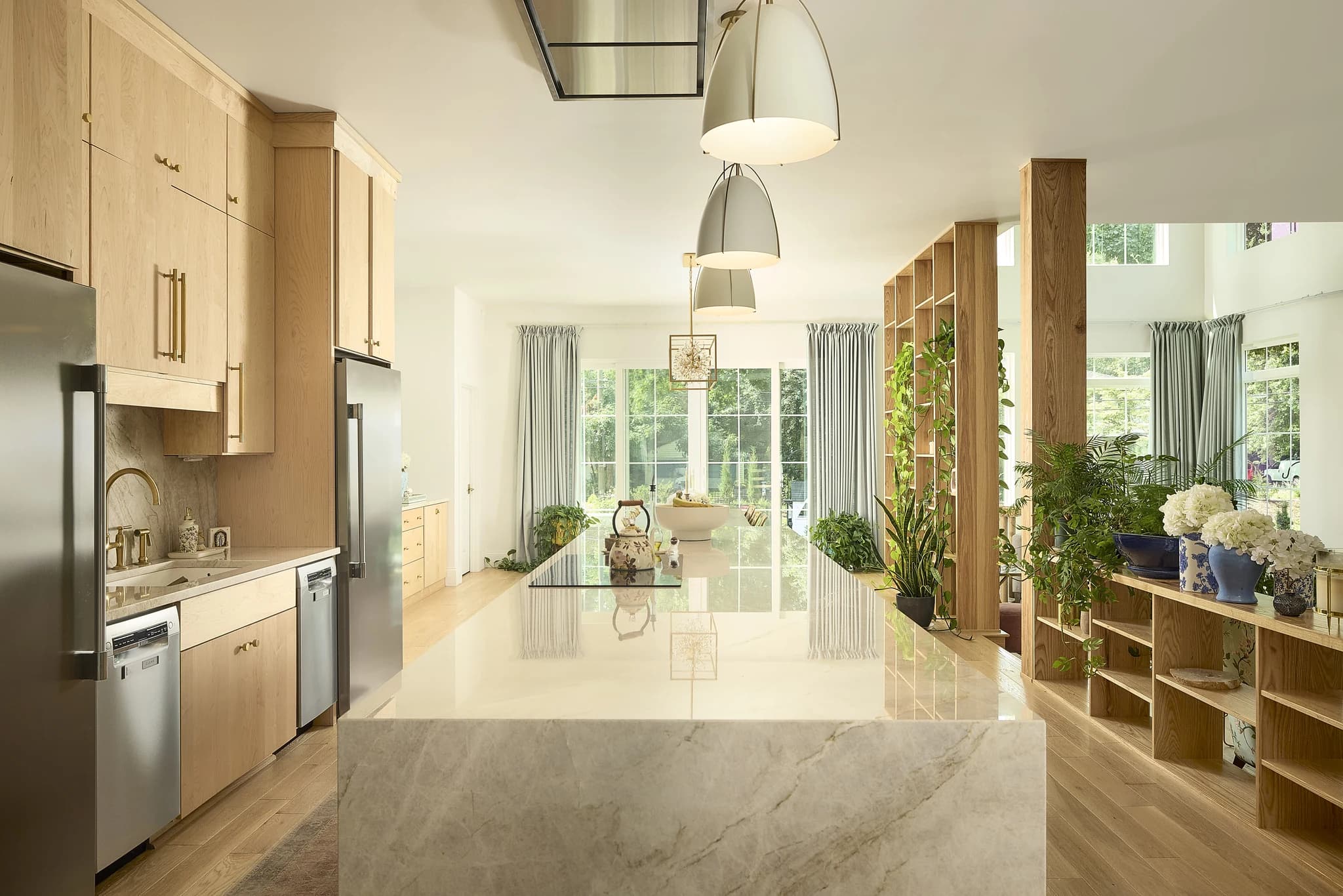 Bright Meridian-Kessler custom kitchen with detailed millwork, generous island, and built-in storage.