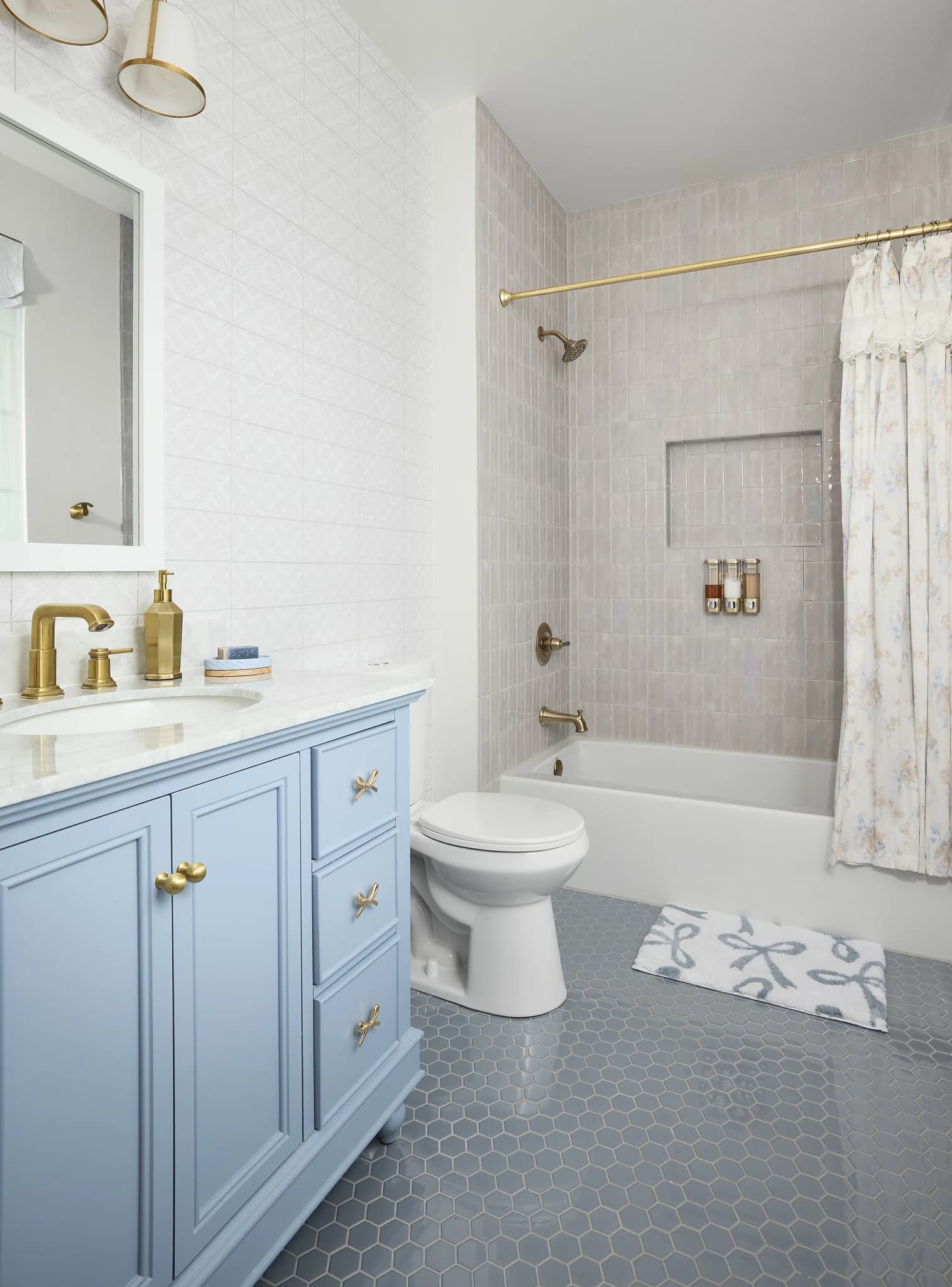 Blue custom vanity and refined tile in a Meridian-Kessler secondary bathroom.
